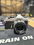 Nikon Fe 35MM Slr Film Camera W/ Nikkor-h Auto 50MM F2 Lens. Fixed Price $125.00.
