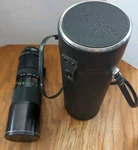 Soligor 100-300MM F/5 Telephoto Ai Lens + Case. Fixed Price $40.00.