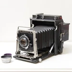 Graflex Crown Graphic Special 4X5 Camera & Optar 135MM F/4.7 Lens -cla'd. Fixed Price $600.00.