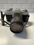 Yashica FX-2 Slr Film Camera Black Silver With Yus Automatic 135MM F/2.8 Lens. Fixed Price $50.00.