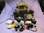 Cannon Ae 1 Camera With Yucksack And Misc. Attachments. Fixed Price $795.00.
