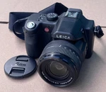 Leica V-lux 1 Digital Camera W/ 7.4-88.8MM F2.8-3.7 Dc Vario Elmarit Asph Lens. Fixed Price $250.75.