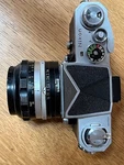 Nikon 35MM Slr Film Camera With 50MM F/1.4 Lens And Prism Finder. Fixed Price $165.00.