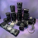 Canon AE-1 35MM Manual Slr Film Camera With Lot Of Lens And Filters. Fixed Price $200.00.