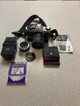 Canon AE-1 Program Camera W/ Quantaray 28-70MM Lens, Data Back A, Power Winder++. Fixed Price $225.00.