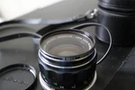 Vintage Minolta Lens F2.8 Rokkor-hg + Leather Case Untested. Fixed Price $75.00.
