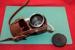 Carl Zeiss Pro-tessar 1:4 F=85 Camera Lens + Leather Carry Case. Fixed Price $45.00.