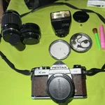 Pentax K-1000 Asahi Camera W 2 50MM 135MM Lens, Accessories And Leather Case. Fixed Price $250.00.