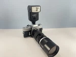 Vtg Minolta SRT201 35MM Film Camera With Kamero Tele-zoom Lens Shutter Clipping. Fixed Price $49.99.