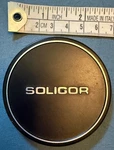 Soligor Metal Front Lens Cap. Fixed Price $6.40.