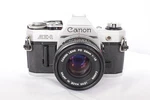Canon AE-1 35MM Slr Film Camera With 50MM F/1.8 Lens Kit, Refurbished & Tested. Fixed Price $219.00.