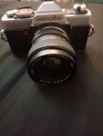 Minolta XG-7 Slr Film Camera With Kamero Auto 1:2.8 F=35MM Lens And Case. Fixed Price $100.00.