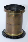 Dallmeyer Rapid Rectilinear 26" F8.8 Brass Lens. Covers 18 X 16". Hood. Flange. Fixed Price $1295.00.
