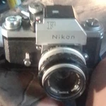 Nikon Silver Vintage 35MM Slr Film Camera Body W/ Lens. Fixed Price $80.00.