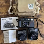 Vintage Nikon L35AF 35MM Point & Shoot Film Camera + Star-d Aux Lenses Manual. Fixed Price $260.00.
